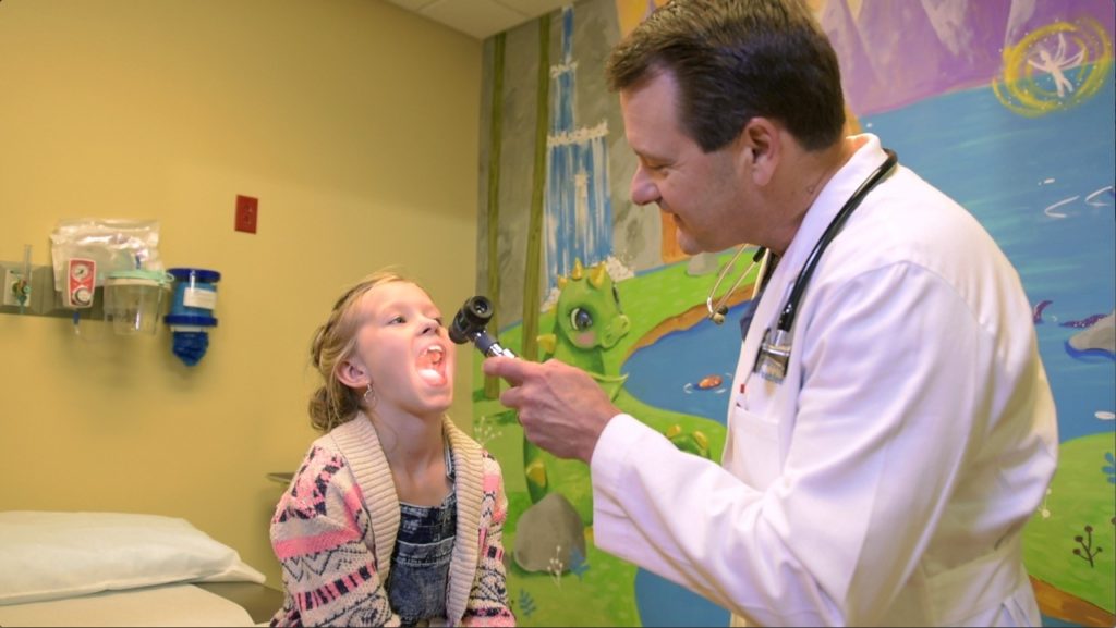 Young patient being checked up by doctor.