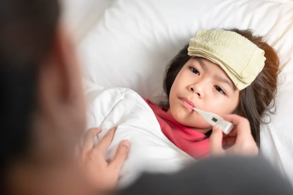 child with a fever from a common cold