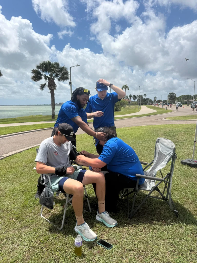 TLC Complete Care team helping runners at the 49th Annual Beach to Bay Relay Marathon in Corpus Christi, TX